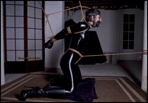 www.tiedinheels.com - Masha Catsuit Captive in the Basement Dungeon! thumbnail